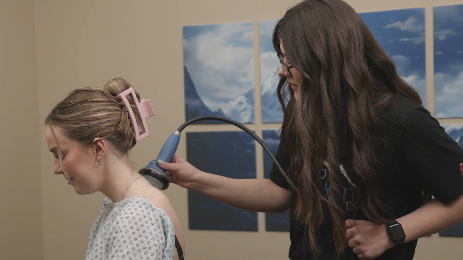 Chiropractor performing posture assessment