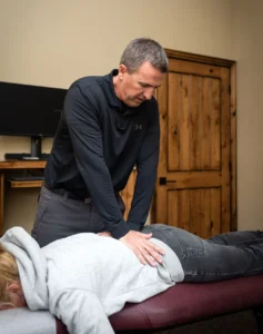Dr. Dustin performing chiropractic adjustment