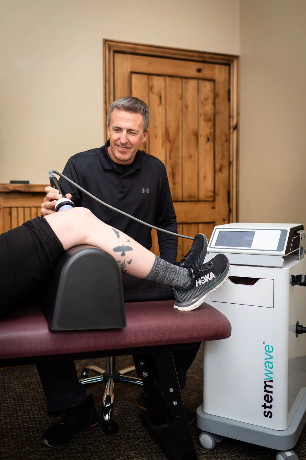 Dr. Dustin providing sports rehabilitation therapy