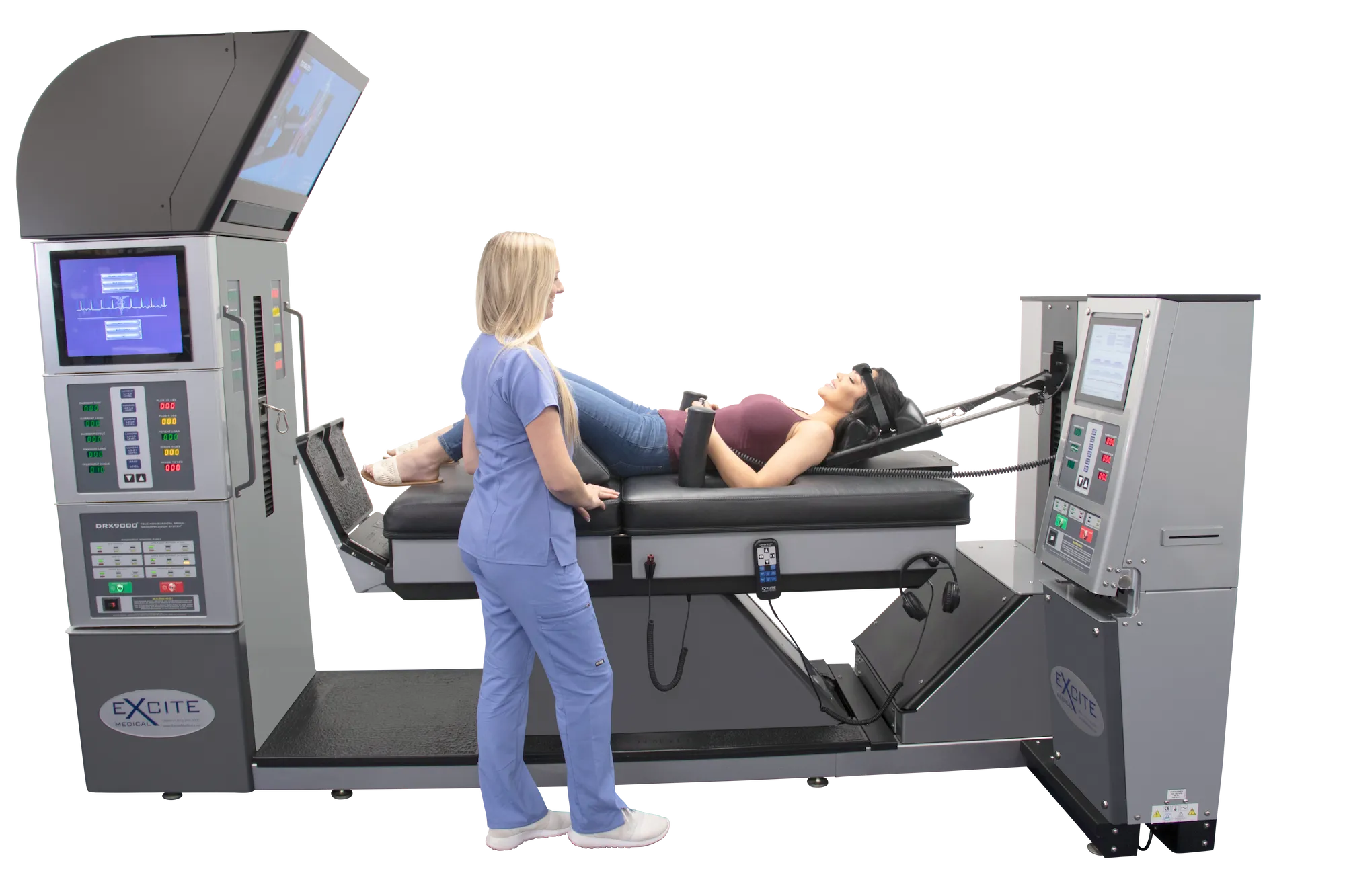 Female chiropractic assistant checking the setup is properly calibrated on the DRX 9000 spinal decompression machine