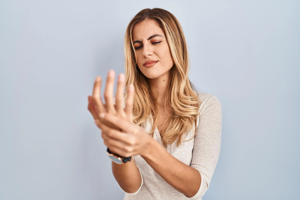 Person experiencing joint pain from arthritis while staying active